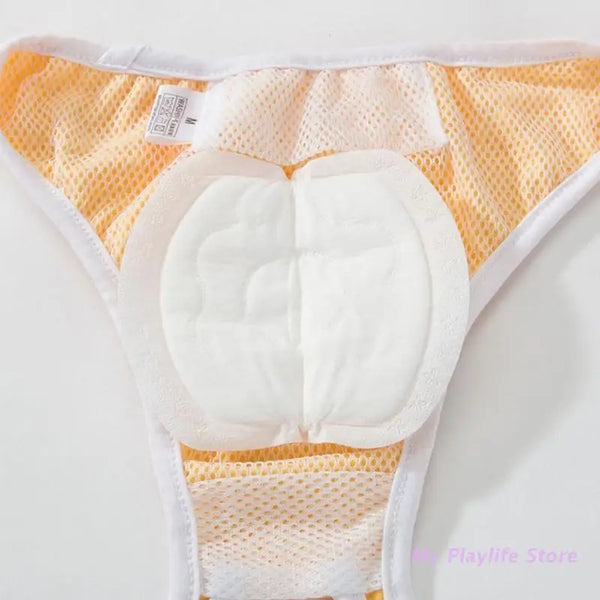 A pack of disposable dog diaper liners in yellow and white with a white absorbent pad.