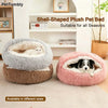Two oval-shaped plush pet beds, one gray and one pink, are displayed on a light floor.