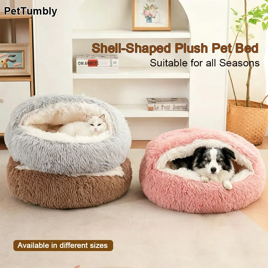 Two oval-shaped plush pet beds, one gray and one pink, are displayed on a light floor.