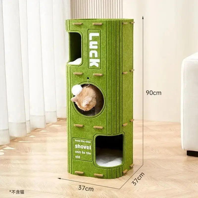 A vertical green cat house with a cutout for climbing and a slot for a claw to hold