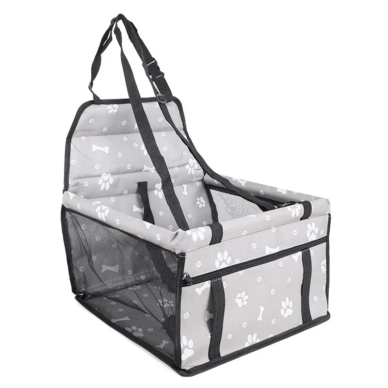 A gray pet travel booster seat with a safety belt for dogs and cats, featuring a mesh enclosure.