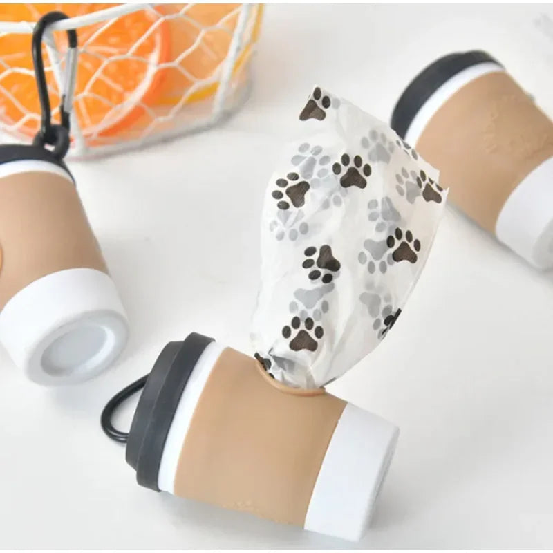 A set of portable pet poop trash can dispensers in beige and white colors.