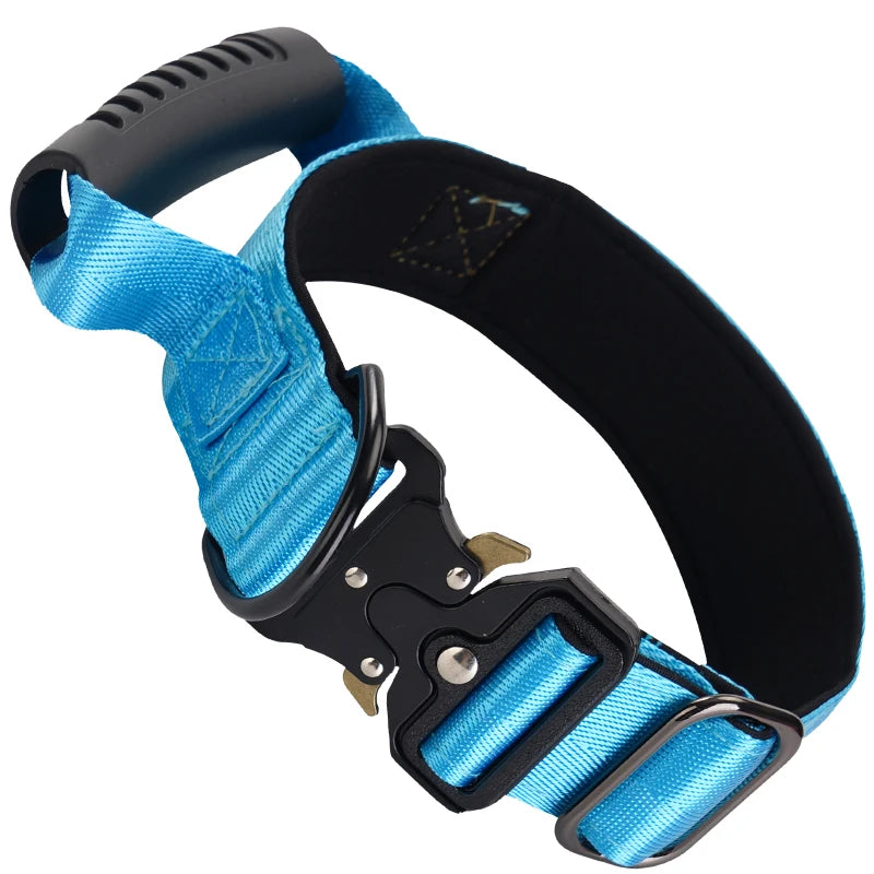 A black tactical dog collar with a blue nylon strap and handle is shown against a white background.