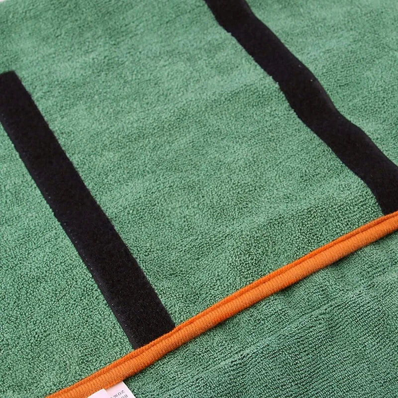 Grüelesches Hundetuch zum Trocknen mit schwarz-orangen Streifen