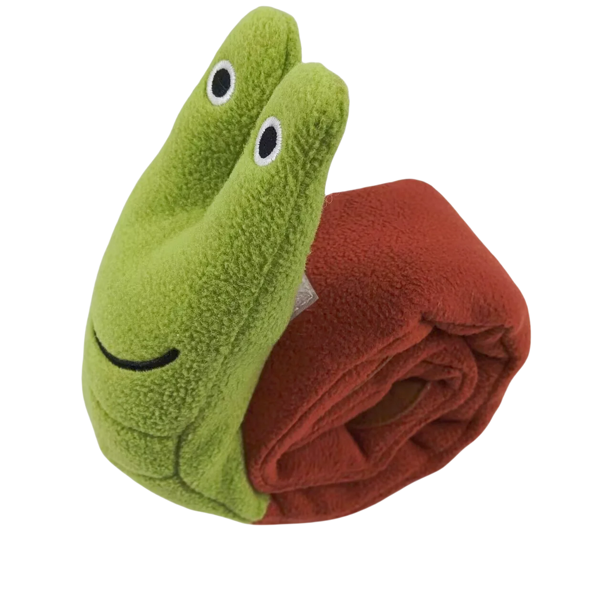 Un jouet en peluche en forme de lézard vert, partiellement visible à côté d'un tissu roulé brun rougeâtre.