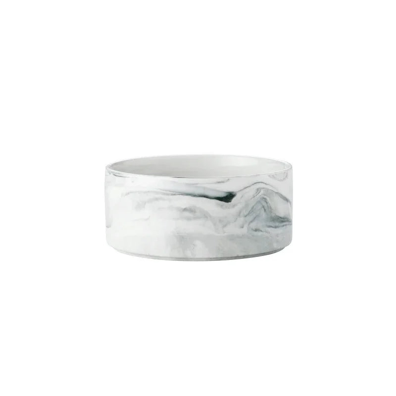 A white and gray marbled ceramic double pet bowl set with a wooden stand.