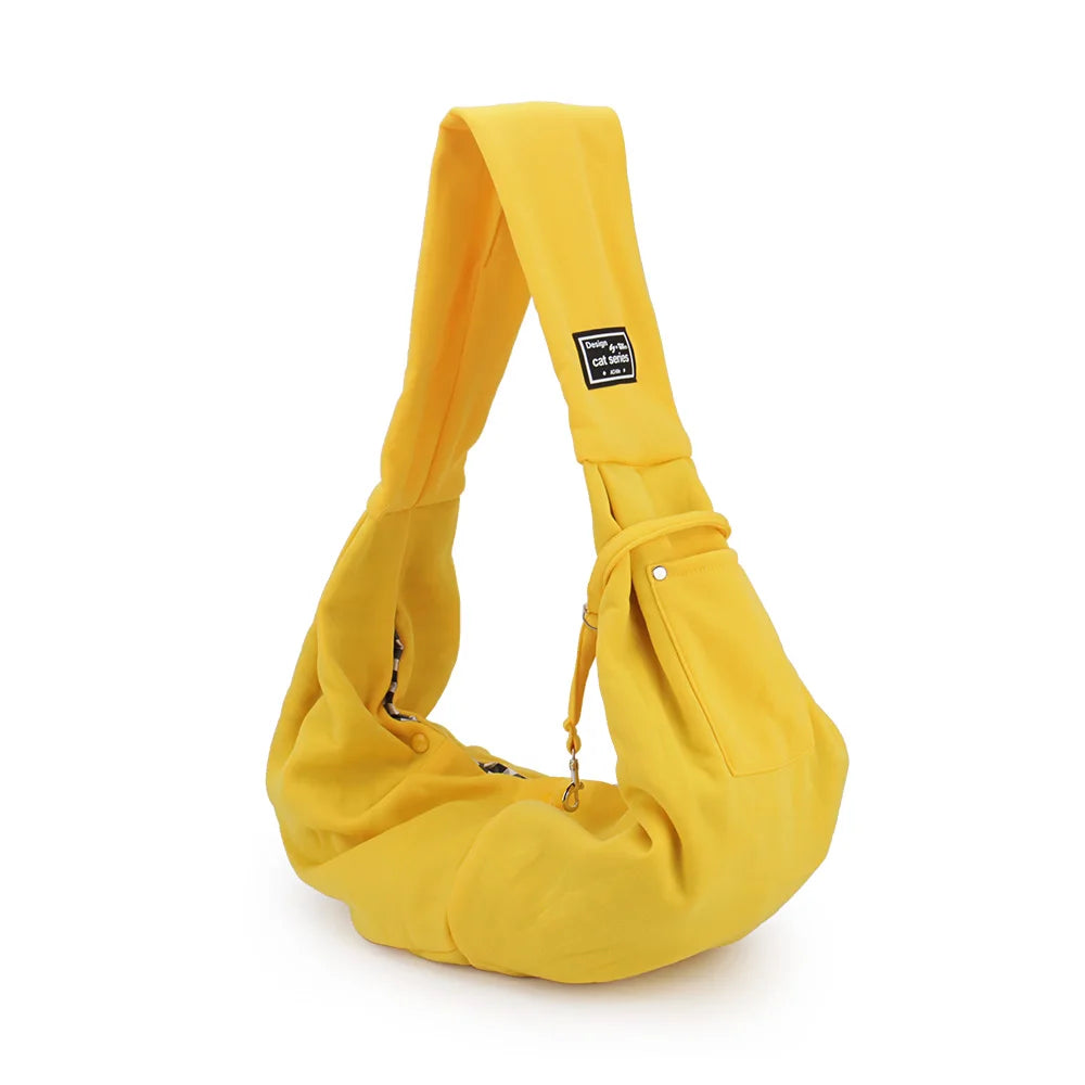 Helle gelbe tragbare Hundetasche/Tragetasche, seitliche Ansicht.