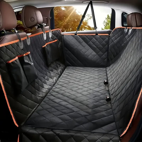 A view of a black quilted waterproof dog car seat cover hammock installed in the back seat of a vehicle.