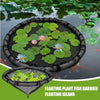 A black floating plant barrier ring with green aquatic plants and a blue flower floating on dark water.
