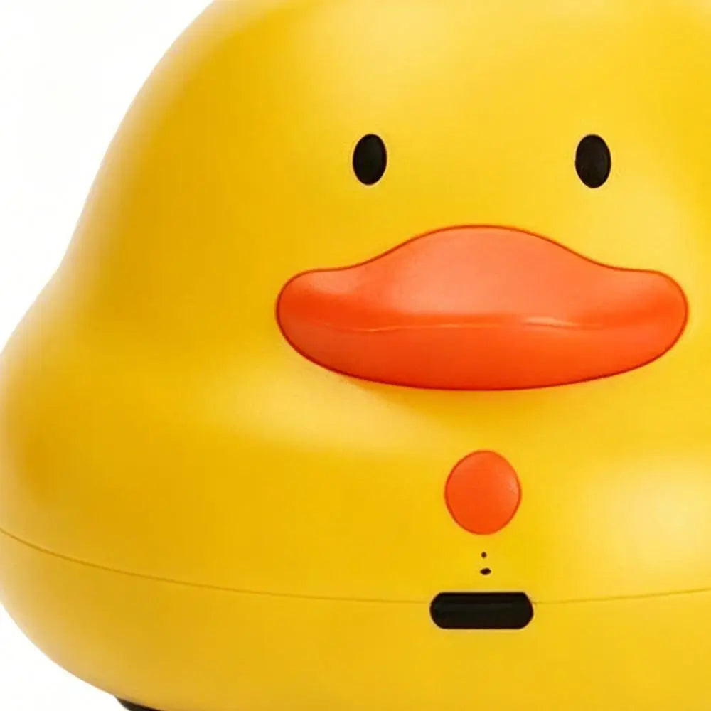A yellow, round interactive cat toy shaped like a chick with an orange beak and eyes.
