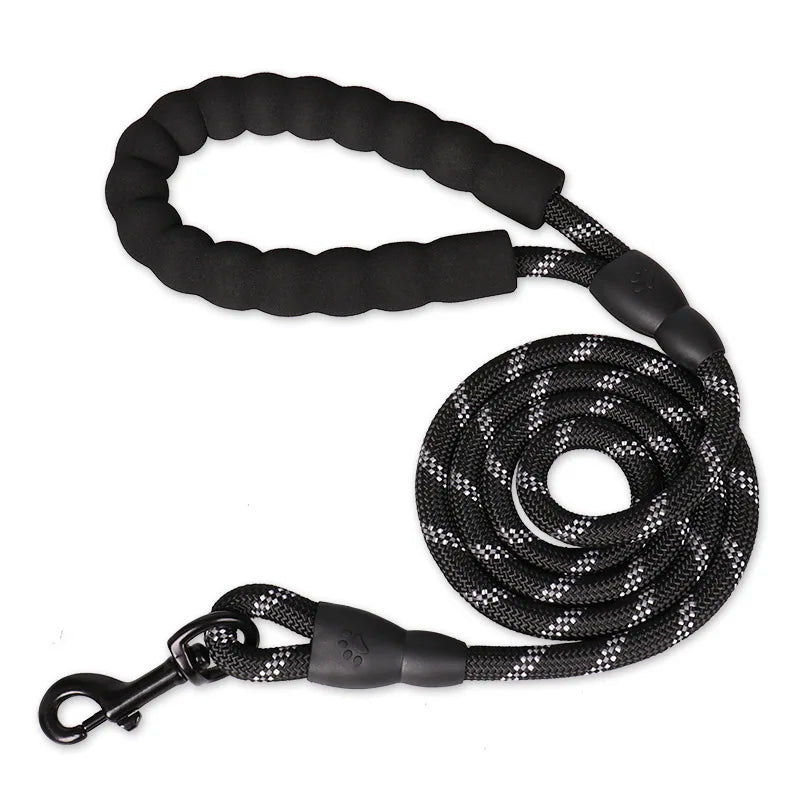 Black durable nylon dog leash with a soft padded handle coiled on a white background