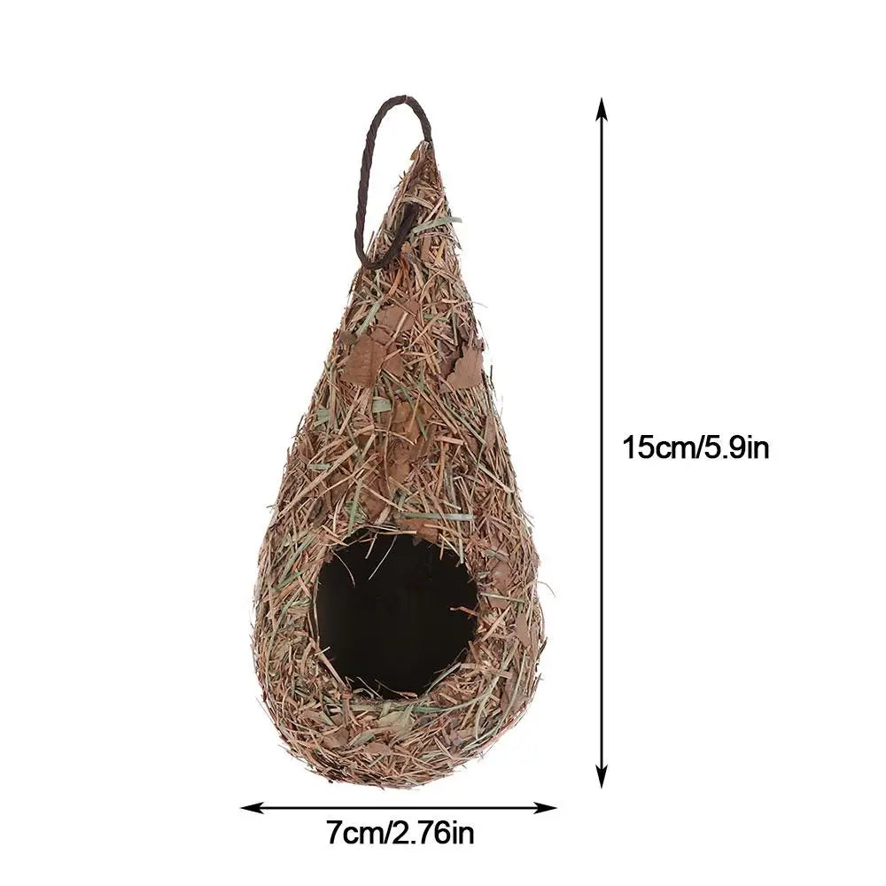 Hand-woven grass bird nest decoration with a conical shape and a hanging string.