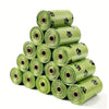 A stack of green heavy duty pet waste bags rolled up for storage.