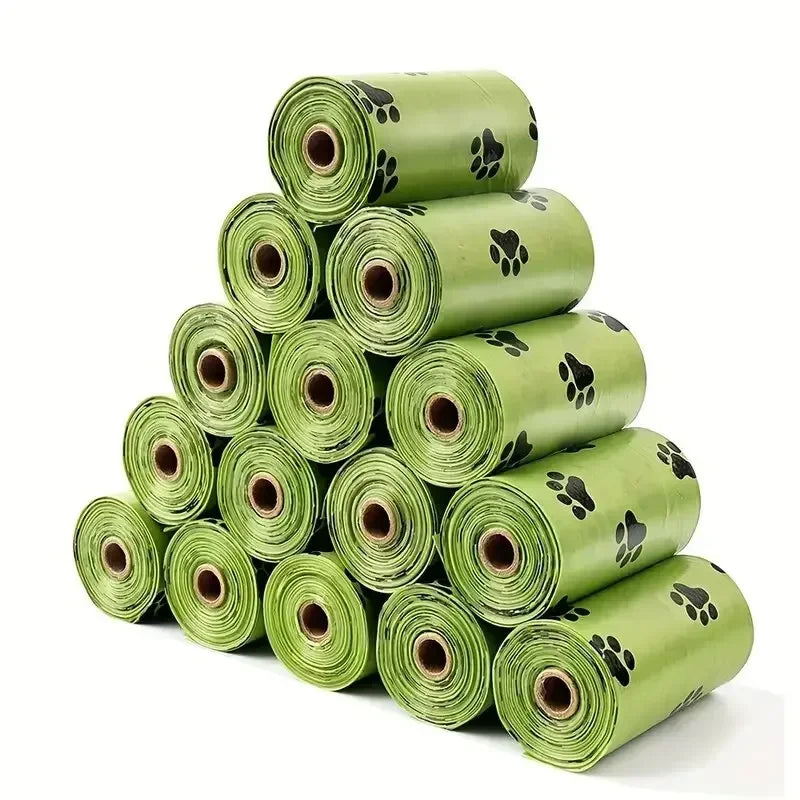 A stack of green heavy duty pet waste bags rolled up for storage.