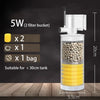 A white submersible aquarium filter with a clear tank, yellow filter material, and accessories shown on a wooden surface.