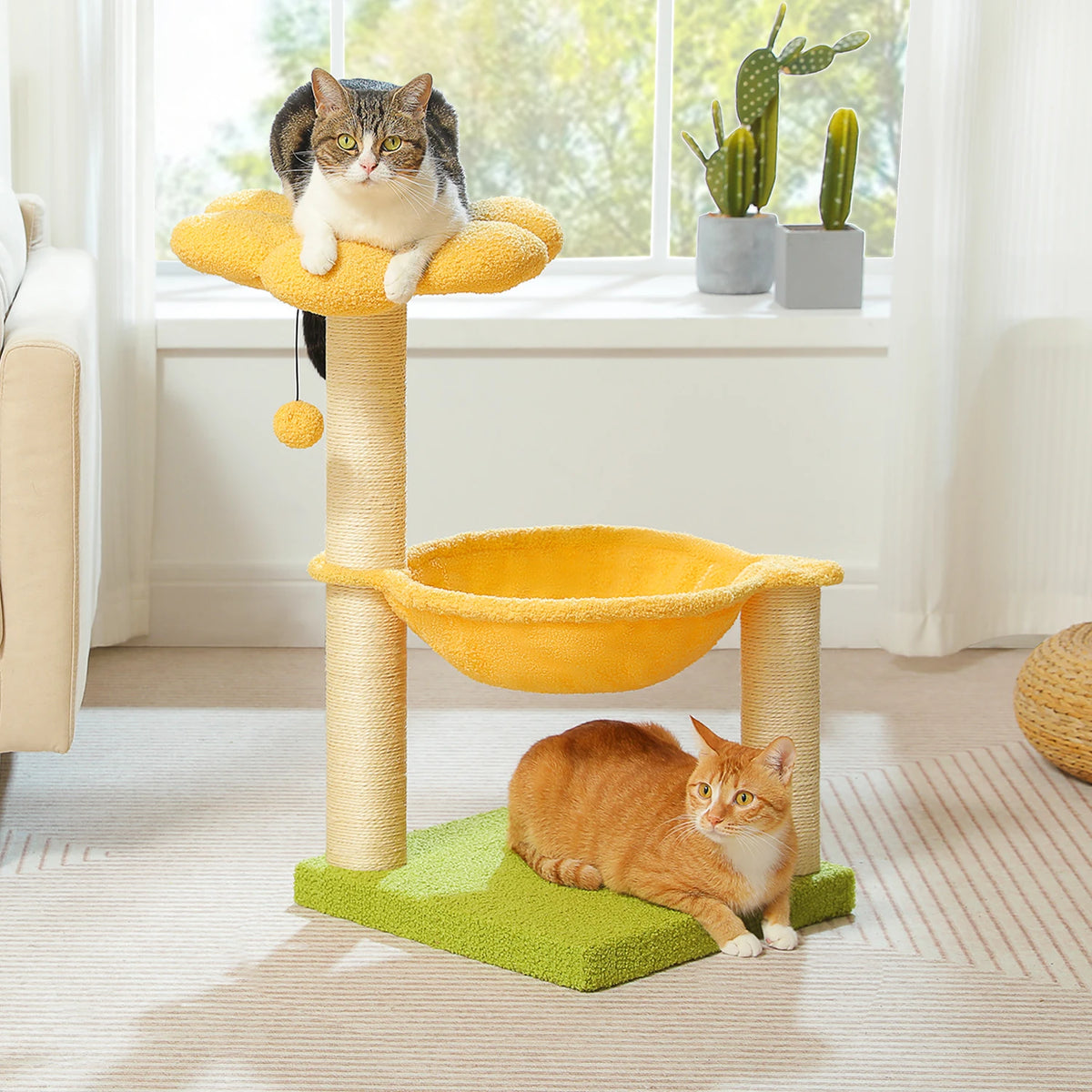 A yellow flower cat tree with a scratching post, hammock, and cozy top perch, featuring a cat on the perch.
