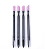 A set of four pink nail file cuticle pusher and buffer tools standing upright.