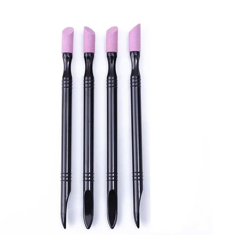 A set of four pink nail file cuticle pusher and buffer tools standing upright.