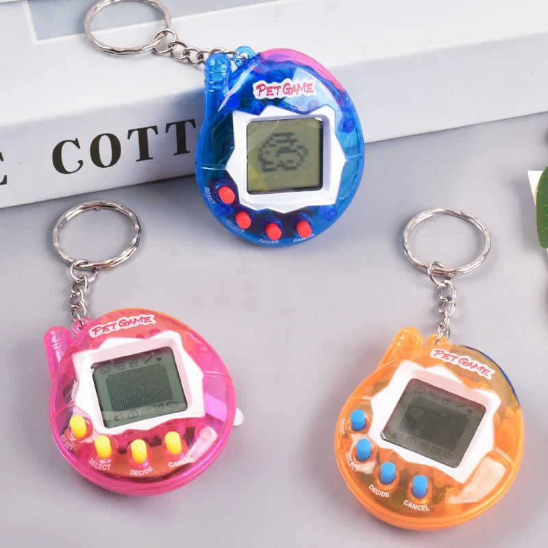 Three clear plastic pet game toys in blue, pink, and orange with digital displays and metal clasps.