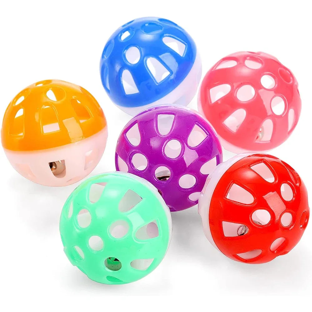 A multi-pack of colorful plastic cat toy balls in shades of blue, orange, pink, purple, and green.
