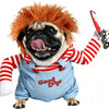 A bulldog wearing a red wig and a blue outfit with a Halloween knife costume