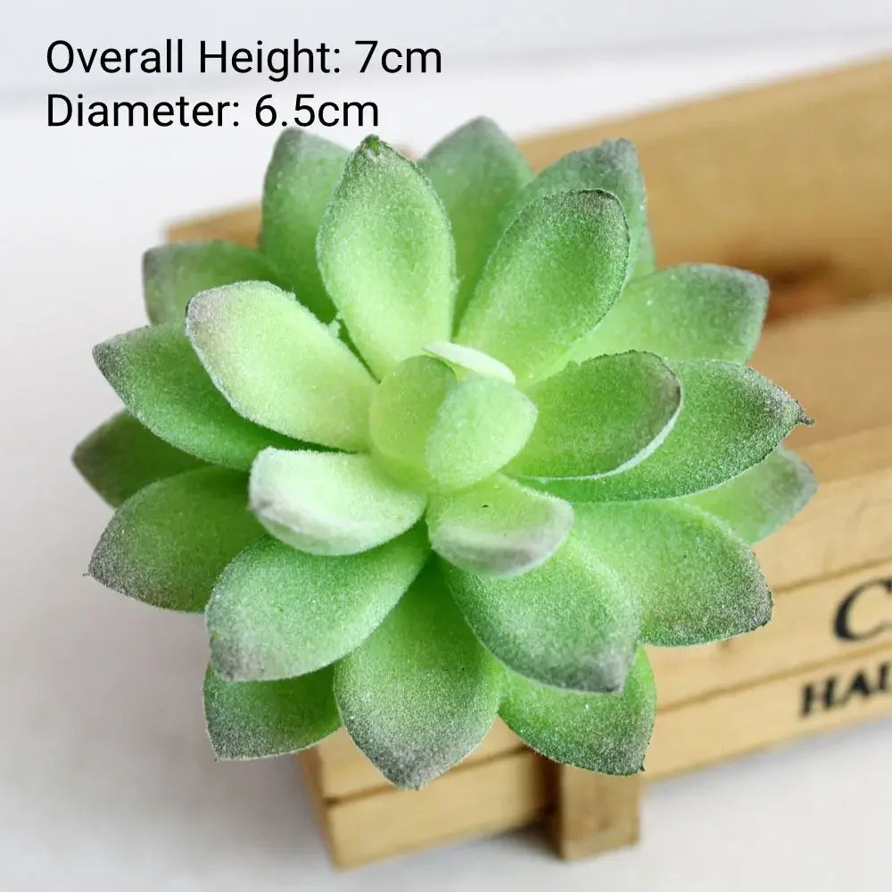 A round, light green flocked artificial succulent plant with a 7cm height and 6.5cm diameter displayed in a wooden box.