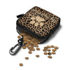 A black leather pet treat pouch with a leopard print design and a clip, next to scattered dry dog treats.