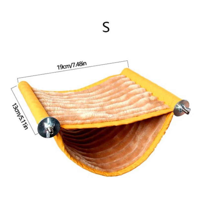 A close-up view of a cozy orange fleece bird hammock for parrots.