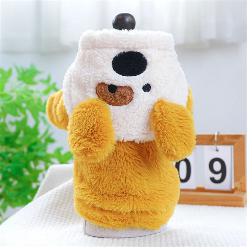 A fluffy orange plush fleece pet overalls for dogs and cats with a black face and yellow paws.