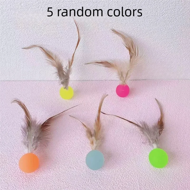Five feathers attached to colorful elastic balls, including yellow, pink, orange, blue-green, and lime green.