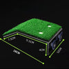 A black basking platform with a green grass ramp and suction cups, shown from an angled view.