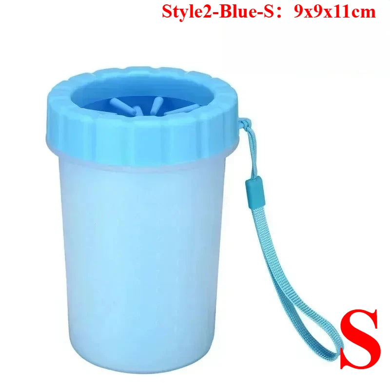 A light blue portable paw washer cup with a silicone brush attachment.