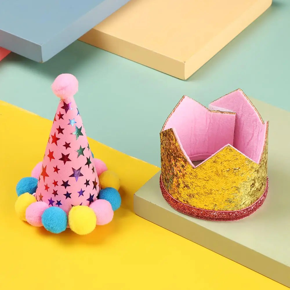 A pink conical party hat with star accents and yellow pom-poms is shown next to a gold sequin box.