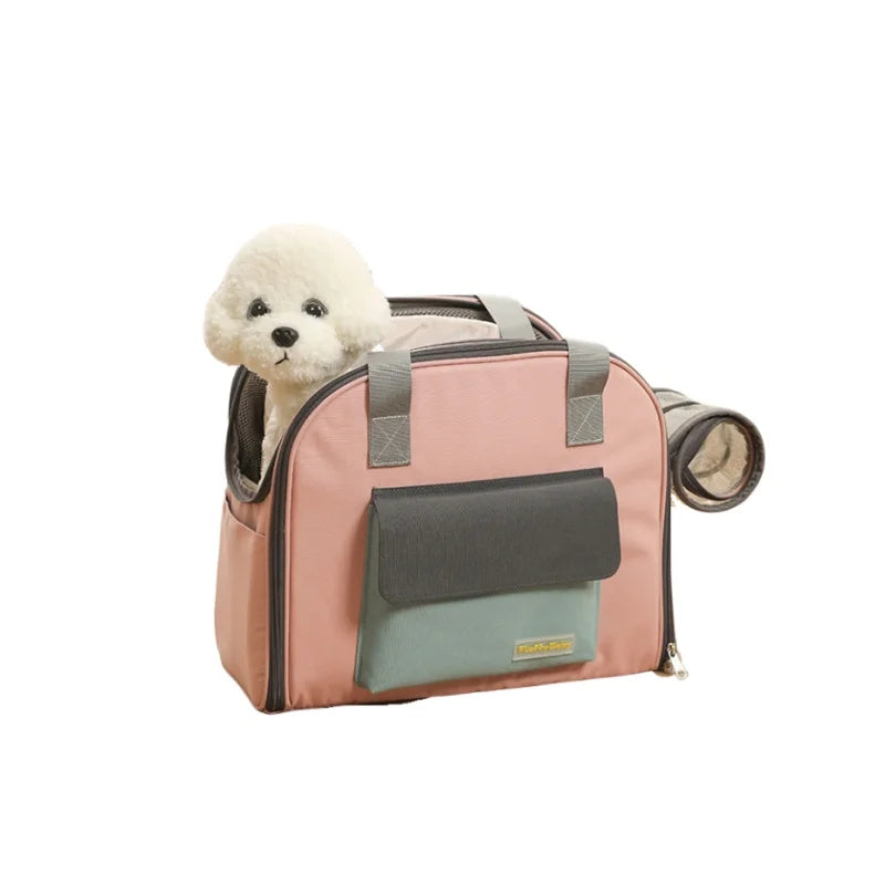 A pink breathable pet carrier backpack with a light-colored fluffy dog head visible.