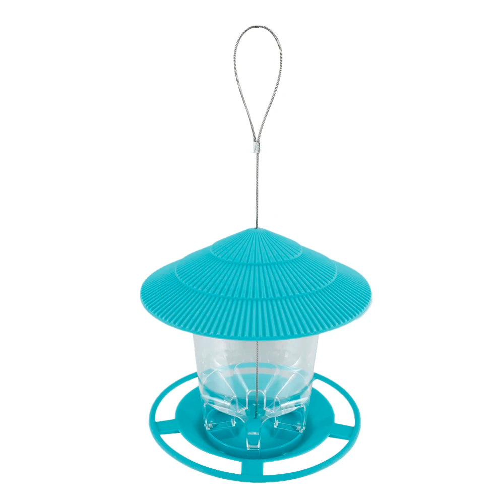 A teal window-mounted bird feeder with a clear viewing panel and a metal hanging wire.