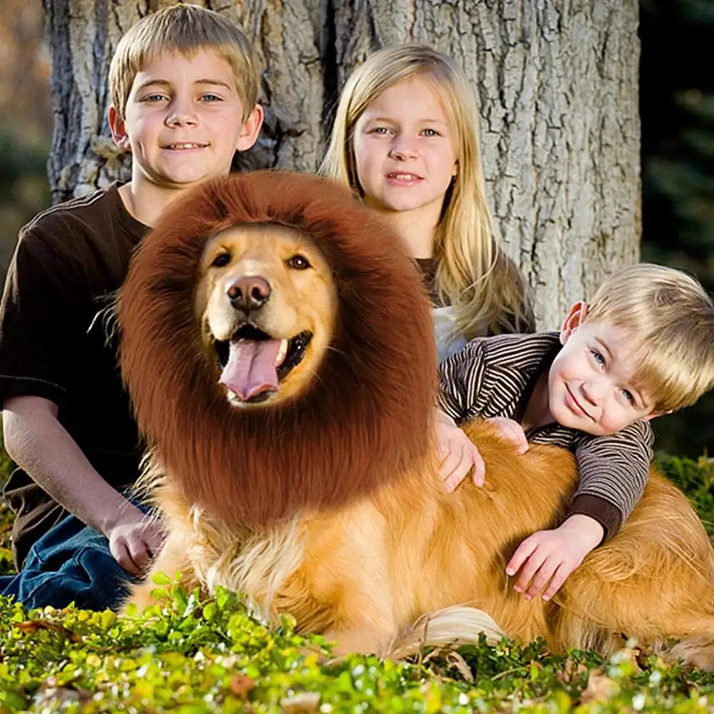 A golden retriever dog wearing a realistic lion mane costume, being held by two children outdoors.