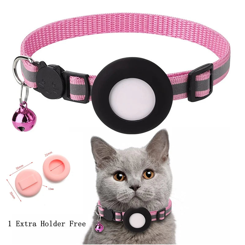 A pink and black breakaway cat collar with a reflective strip and an airtag holder is shown alongside spare holders.