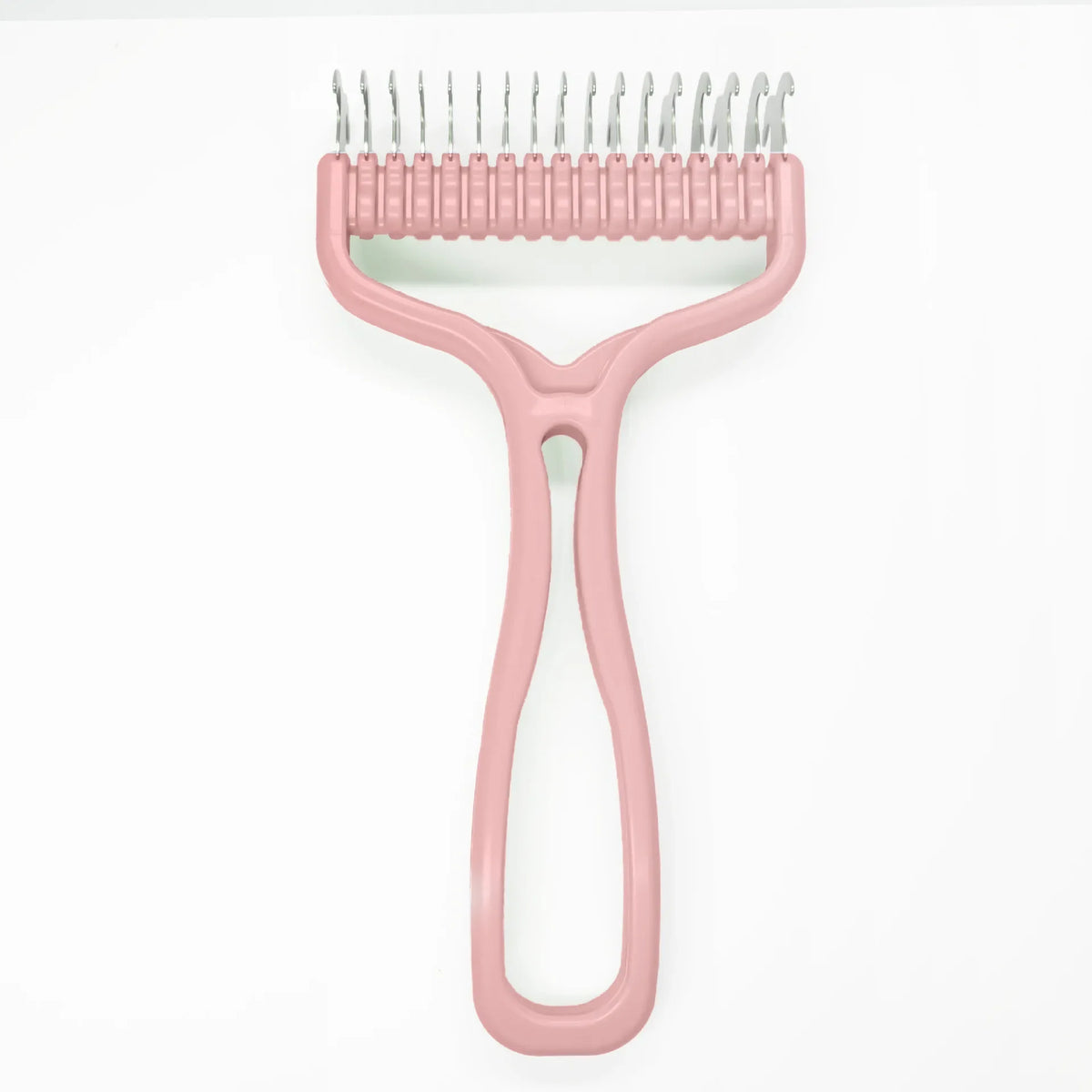 A pink 2-in-1 pet grooming brush with a comb and knot remover tool.
