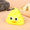 A bright yellow silicone dispenser shaped like a smiling dog face with black eyes and a black clip.