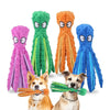 Five plush octopus dog toys in pink, green, orange, and blue with crinkle legs next to a dog.