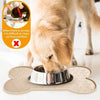A dog is eating from an anti-slip silicone pet feeding mat designed to prevent food overflow.