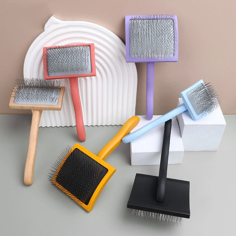 A collection of various grooming rakes and brushes with stainless steel teeth in shades of pink, purple, blue, and black.