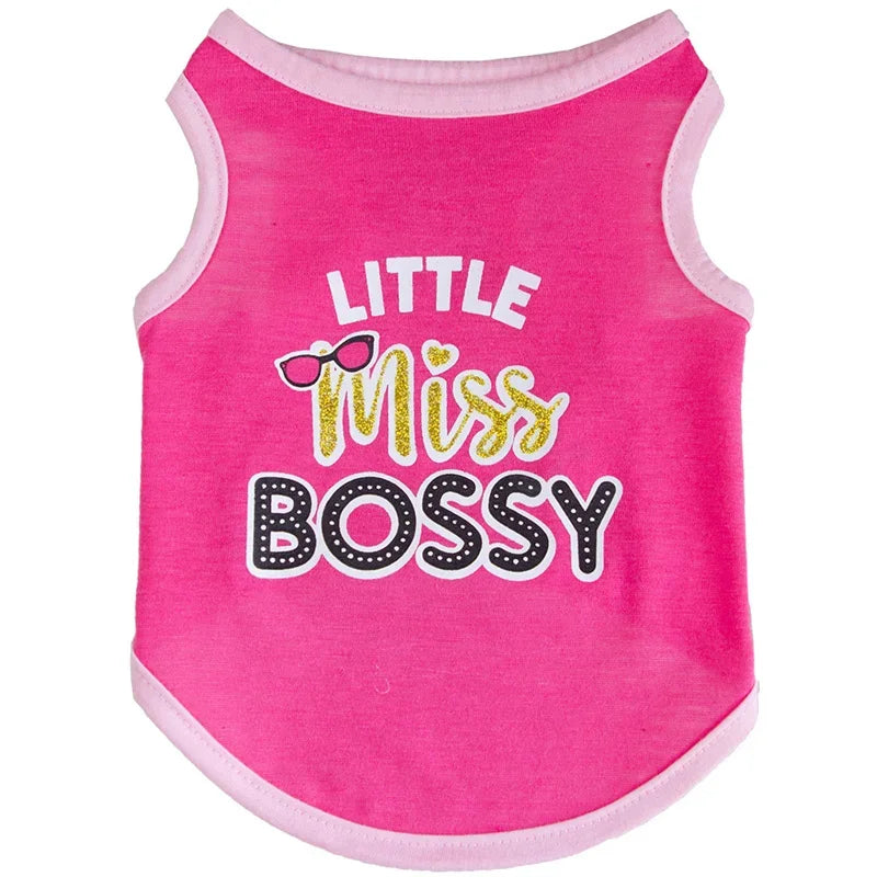 Pink sleeveless dog vest with the text Little Miss Bossy printed in gold and black lettering