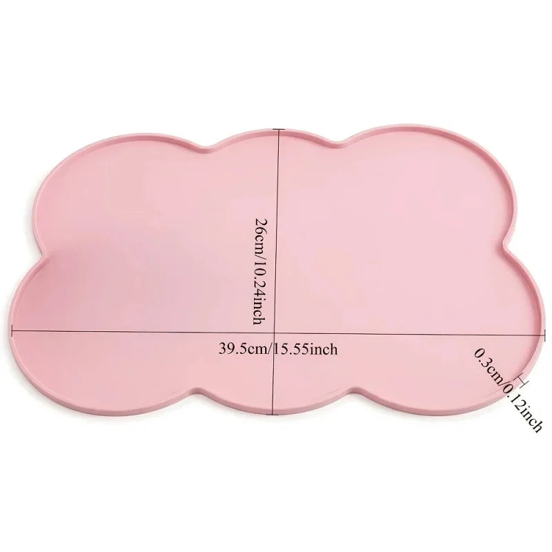 A pink waterproof silicone pet feeding mat with a raised edge, measuring 39.5cm by 26cm.