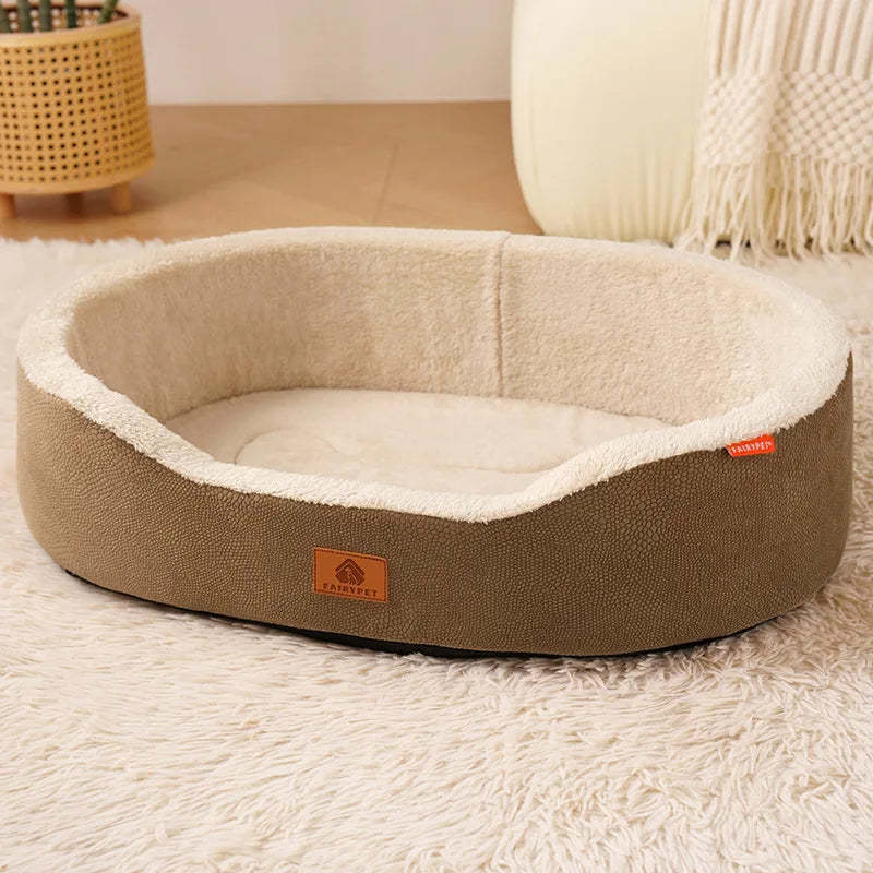 A round, tan dog house bed with a beige fleece lining rests on a white fluffy rug.