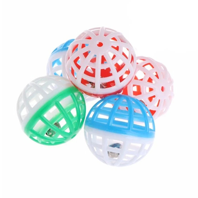 A collection of ten plastic cat ball toys with bells in various colors including pink, white, and green.