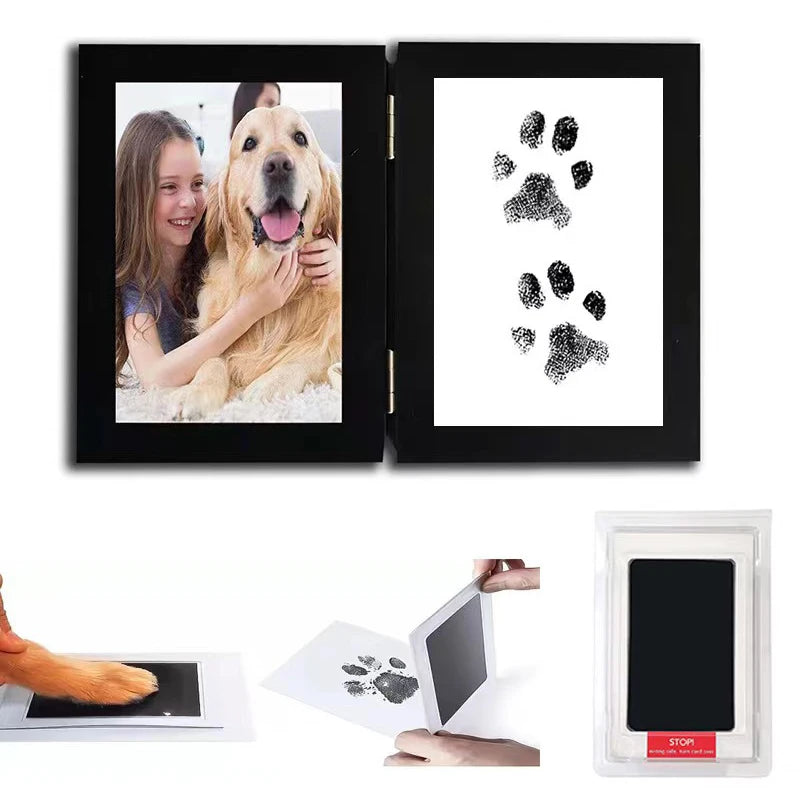 A set of pet paw print and handprint supplies including framed prints on black mats and a clear display box.