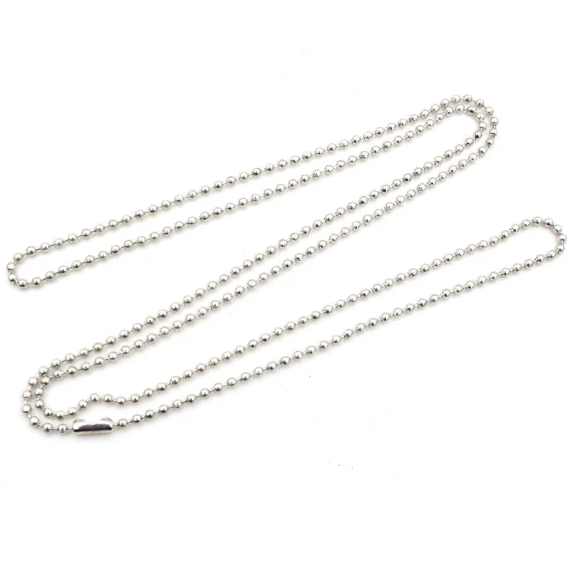 A set of gold and silver plated ball necklaces displayed against a white background.