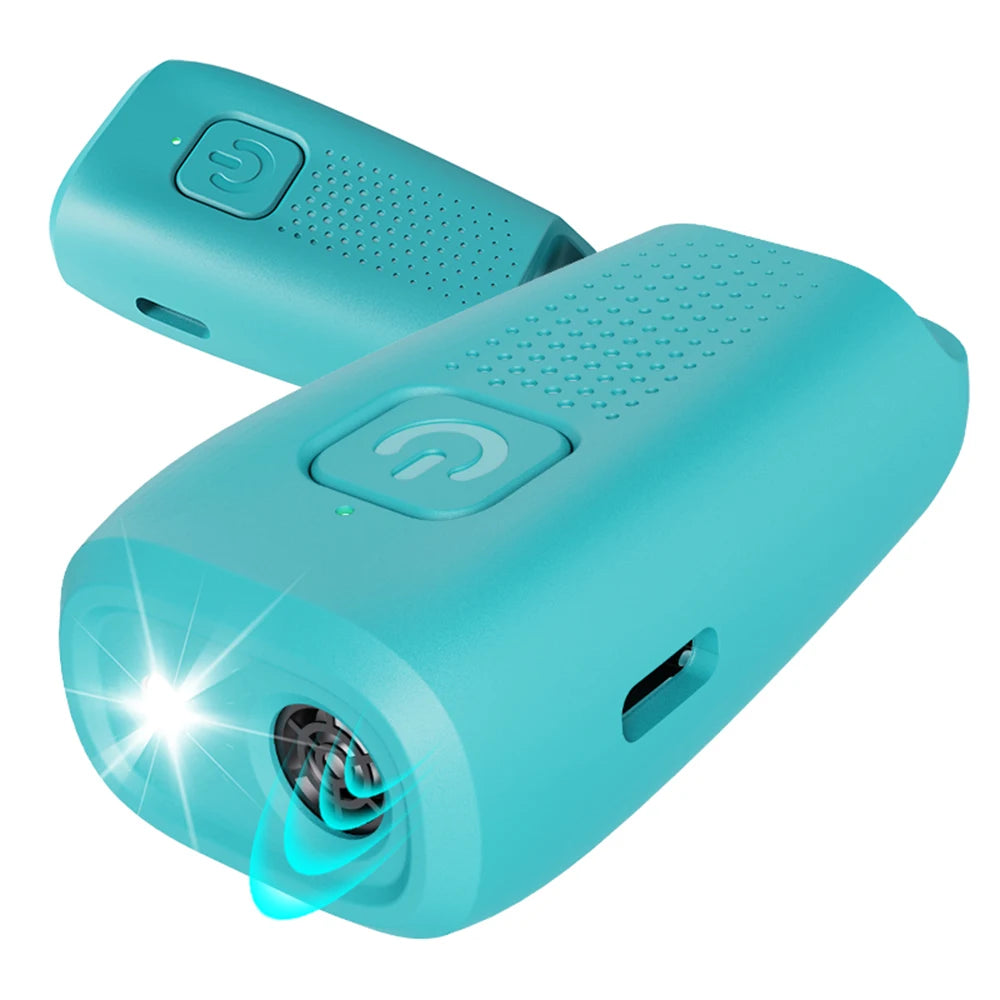 A teal ultrasonic dog bark stopper device with a button and an LED light, shown from above.
