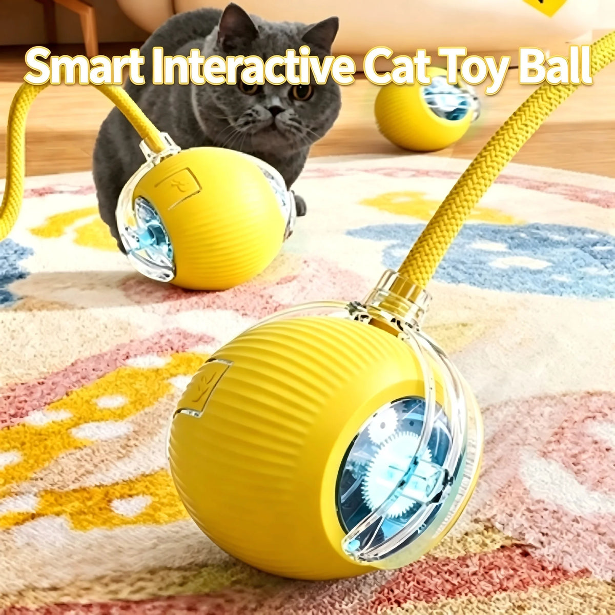 A yellow smart interactive cat toy ball with a clear dome and wire, next to a gray cat on a rug.